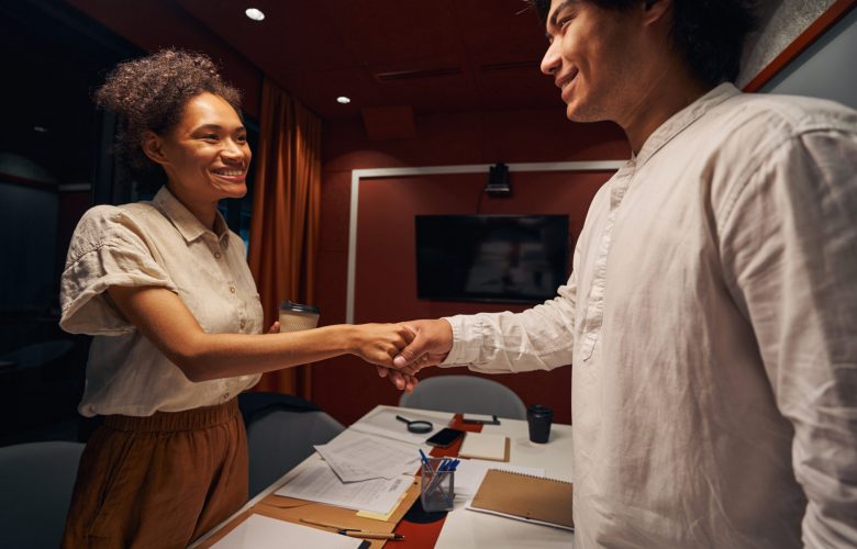 Woman having break together with man on workplace. Worker preparing for meeting