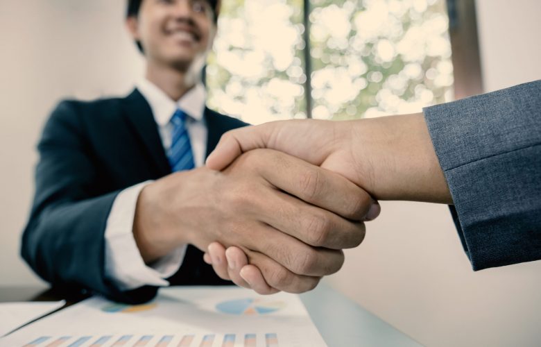 hands shake after business office executives are interviewing job applicants in the meeting room.